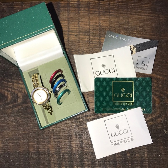 Gucci Accessories - Gucci gold tone watch with 6 interchangeable bezel